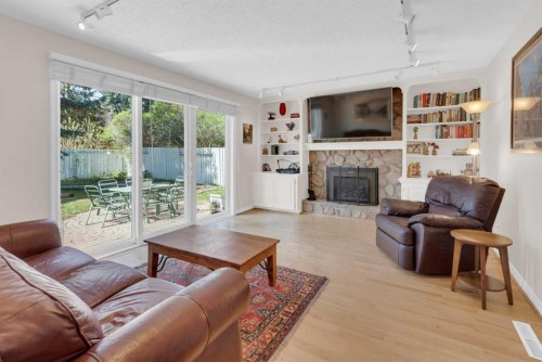 7316 Kananaskis Drive Sw, Calgary, AB - Indoor Photo Showing Living Room With Fireplace