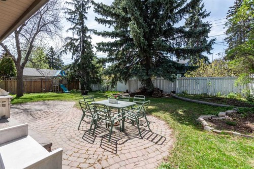 7316 Kananaskis Drive Sw, Calgary, AB - Outdoor With Deck Patio Veranda With Backyard