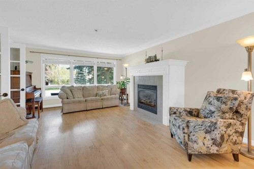7316 Kananaskis Drive Sw, Calgary, AB - Indoor Photo Showing Living Room With Fireplace