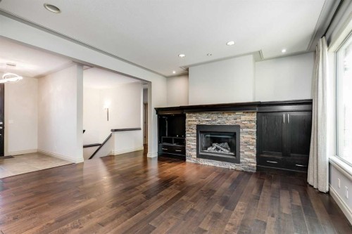 30 Meadow Pointe Drive, Heritage Pointe, AB - Indoor Photo Showing Living Room With Fireplace