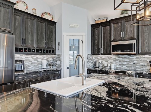 137 Westview Drive, Nanton, AB - Indoor Photo Showing Kitchen With Double Sink With Upgraded Kitchen