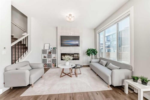 47 Amblefield Grove Nw, Calgary, AB - Indoor Photo Showing Living Room With Fireplace