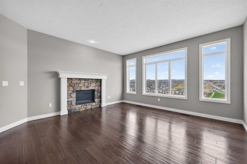 30 Evansborough View Nw, Calgary, AB - Indoor Photo Showing Living Room With Fireplace