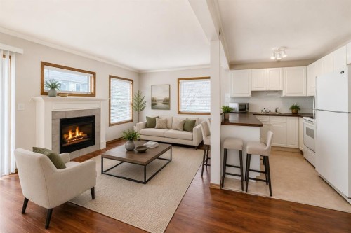 152 Country Hills Villas Nw, Calgary, AB - Indoor Photo Showing Living Room With Fireplace
