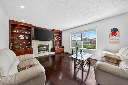 98 Hampstead Circle Nw, Calgary, AB - Indoor Photo Showing Living Room With Fireplace