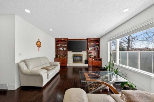 98 Hampstead Circle Nw, Calgary, AB - Indoor Photo Showing Living Room With Fireplace