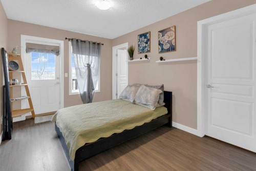 17-28 Heritage Drive, Cochrane, AB - Indoor Photo Showing Bedroom