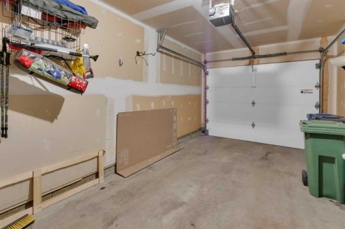 17-28 Heritage Drive, Cochrane, AB - Indoor Photo Showing Garage