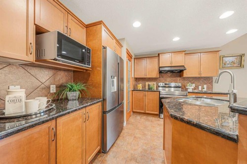94 Kincora Gardens, Calgary, AB - Indoor Photo Showing Kitchen With Stainless Steel Kitchen With Double Sink