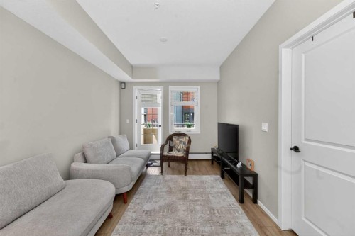 218-140 Mahogany Street Se, Calgary, AB - Indoor Photo Showing Living Room