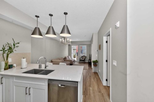 218-140 Mahogany Street Se, Calgary, AB - Indoor Photo Showing Kitchen With Double Sink