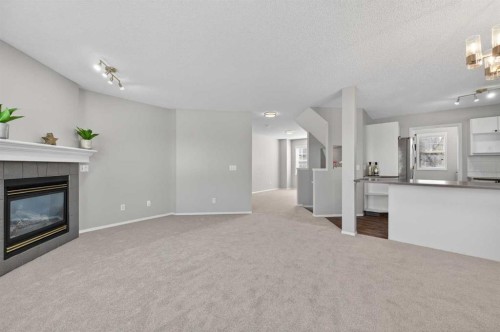 3106-7171 Coach Hill Road Sw, Calgary, AB - Indoor Photo Showing Living Room With Fireplace