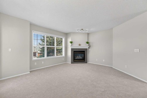 3106-7171 Coach Hill Road Sw, Calgary, AB - Indoor Photo Showing Living Room With Fireplace