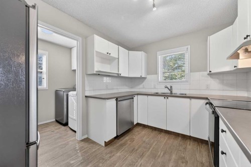 3106-7171 Coach Hill Road Sw, Calgary, AB - Indoor Photo Showing Kitchen With Double Sink