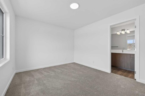 56 Creekside Drive Sw, Calgary, AB - Indoor Photo Showing Other Room