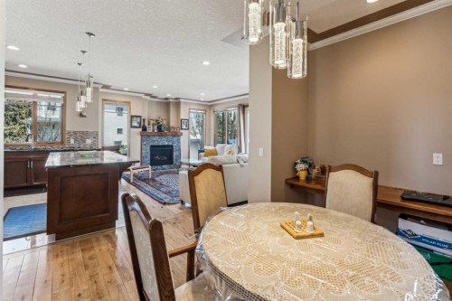 4538 Montgomery Avenue Nw, Calgary, AB - Indoor Photo Showing Dining Room With Fireplace