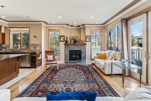 4538 Montgomery Avenue Nw, Calgary, AB - Indoor Photo Showing Living Room With Fireplace