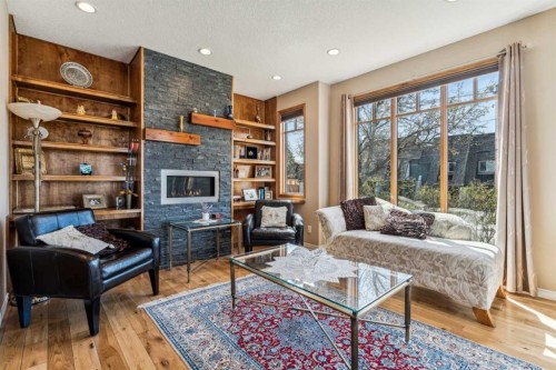 4538 Montgomery Avenue Nw, Calgary, AB - Indoor Photo Showing Living Room With Fireplace