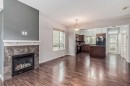 219 Kincora Lane Nw, Calgary, AB  - Indoor Photo Showing Living Room With Fireplace 