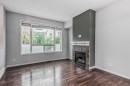 219 Kincora Lane Nw, Calgary, AB  - Indoor Photo Showing Living Room With Fireplace 