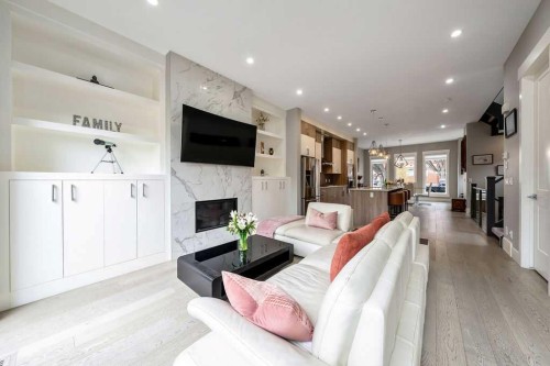 639 19 Avenue Nw, Calgary, AB - Indoor Photo Showing Living Room With Fireplace