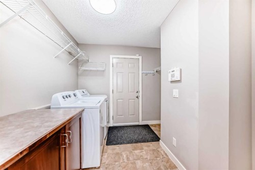 455 Hidden Creek Boulevard Nw, Calgary, AB - Indoor Photo Showing Laundry Room