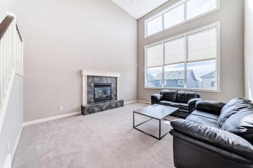 455 Hidden Creek Boulevard Nw, Calgary, AB - Indoor Photo Showing Living Room With Fireplace