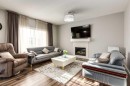 165 Bayside Loop Sw, Airdrie, AB  - Indoor Photo Showing Living Room With Fireplace 