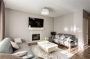 165 Bayside Loop Sw, Airdrie, AB  - Indoor Photo Showing Living Room With Fireplace 