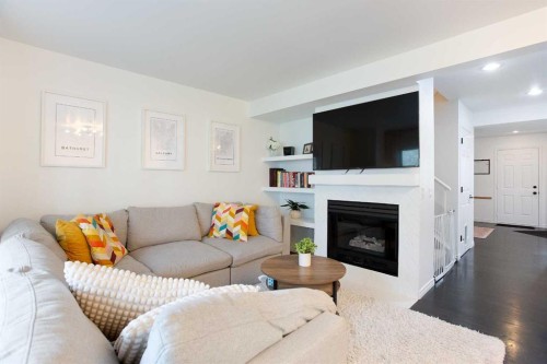 184 Inglewood Cove Se, Calgary, AB - Indoor Photo Showing Living Room With Fireplace