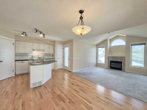 206 Tuscany Drive Nw, Calgary, AB - Indoor Photo Showing Other Room With Fireplace