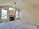 206 Tuscany Drive Nw, Calgary, AB  - Indoor Photo Showing Living Room With Fireplace 