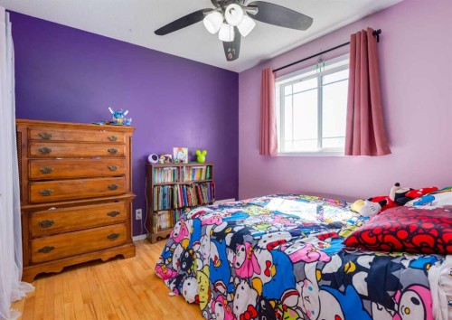 244 Stonegate Close Nw, Airdrie, AB - Indoor Photo Showing Bedroom