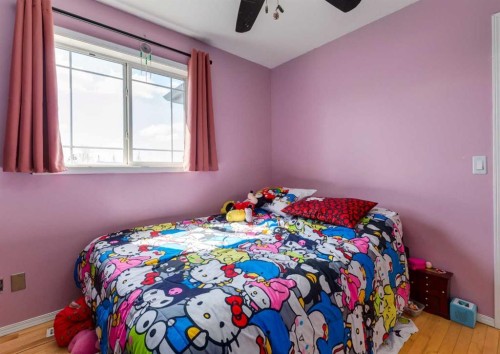 244 Stonegate Close Nw, Airdrie, AB - Indoor Photo Showing Bedroom