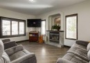 244 Stonegate Close Nw, Airdrie, AB  - Indoor Photo Showing Living Room With Fireplace 