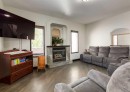 244 Stonegate Close Nw, Airdrie, AB  - Indoor Photo Showing Living Room With Fireplace 