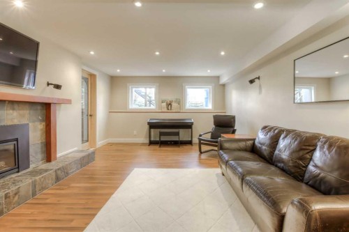 2519 Cherokee Drive Nw, Calgary, AB - Indoor Photo Showing Living Room With Fireplace
