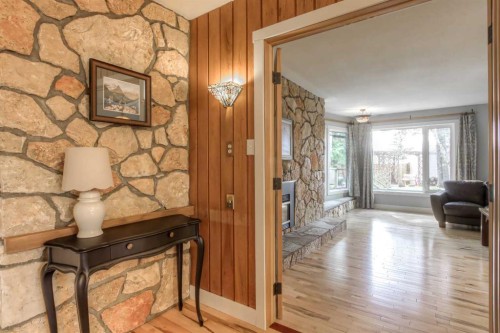 2519 Cherokee Drive Nw, Calgary, AB - Indoor Photo Showing Other Room With Fireplace