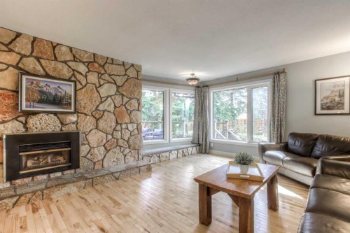 2519 Cherokee Drive Nw, Calgary, AB - Indoor Photo Showing Living Room With Fireplace
