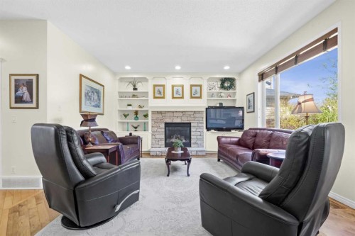 609 Chaparral Drive Se, Calgary, AB - Indoor Photo Showing Living Room With Fireplace