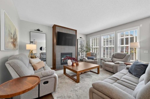 93 Legacy Green Se, Calgary, AB - Indoor Photo Showing Living Room With Fireplace