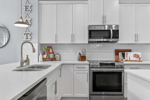 93 Legacy Green Se, Calgary, AB - Indoor Photo Showing Kitchen With Double Sink With Upgraded Kitchen