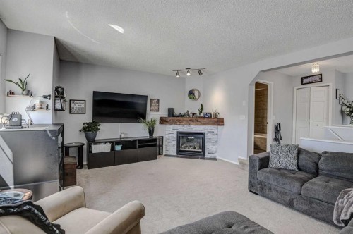 181 Citadel Ridge Close Nw, Calgary, AB - Indoor Photo Showing Living Room With Fireplace