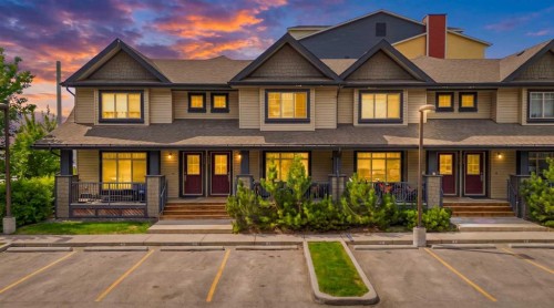 1311-121 Copperpond Common North, Calgary, AB - Outdoor With Deck Patio Veranda With Facade