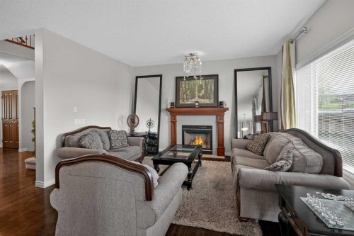 32 Evanspark Circle Nw, Calgary, AB - Indoor Photo Showing Living Room With Fireplace