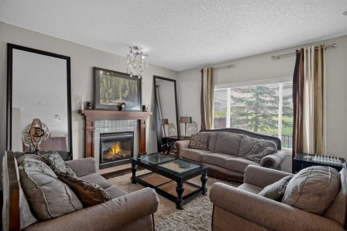 32 Evanspark Circle Nw, Calgary, AB - Indoor Photo Showing Living Room With Fireplace