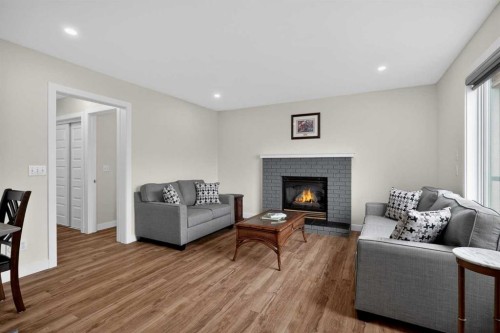 84 Shawbrooke Circle Sw, Calgary, AB - Indoor Photo Showing Living Room With Fireplace