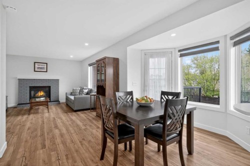 84 Shawbrooke Circle Sw, Calgary, AB - Indoor Photo Showing Dining Room With Fireplace