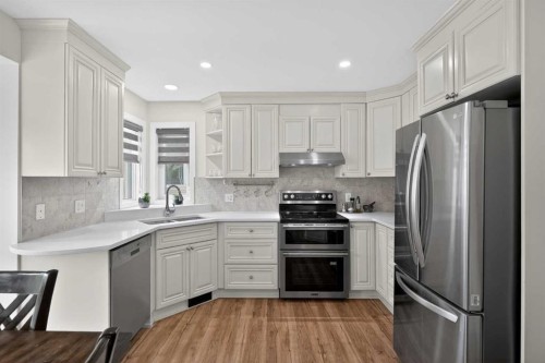 84 Shawbrooke Circle Sw, Calgary, AB - Indoor Photo Showing Kitchen With Stainless Steel Kitchen With Double Sink With Upgraded Kitchen