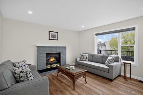 84 Shawbrooke Circle Sw, Calgary, AB - Indoor Photo Showing Living Room With Fireplace